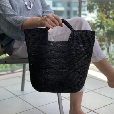 A crocheted raffia handbag