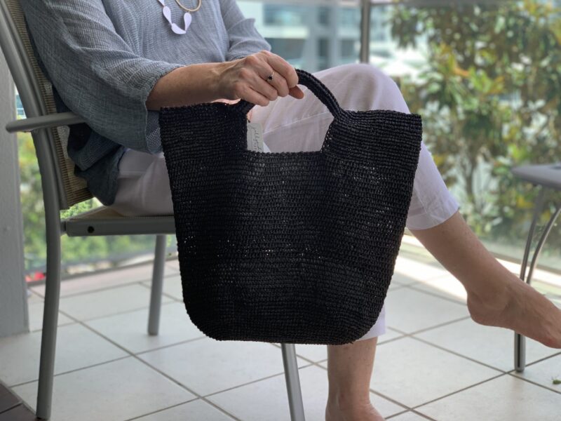 A crocheted raffia handbag