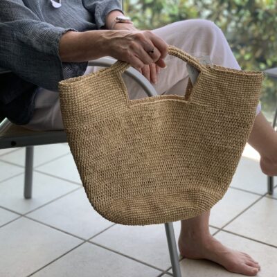 A crocheted raffia handbag