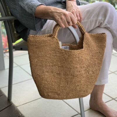 A crocheted raffia handbag